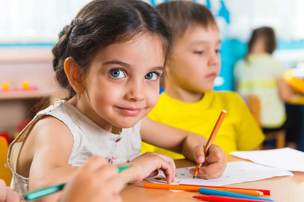 A tutor helps a student with reading practice.